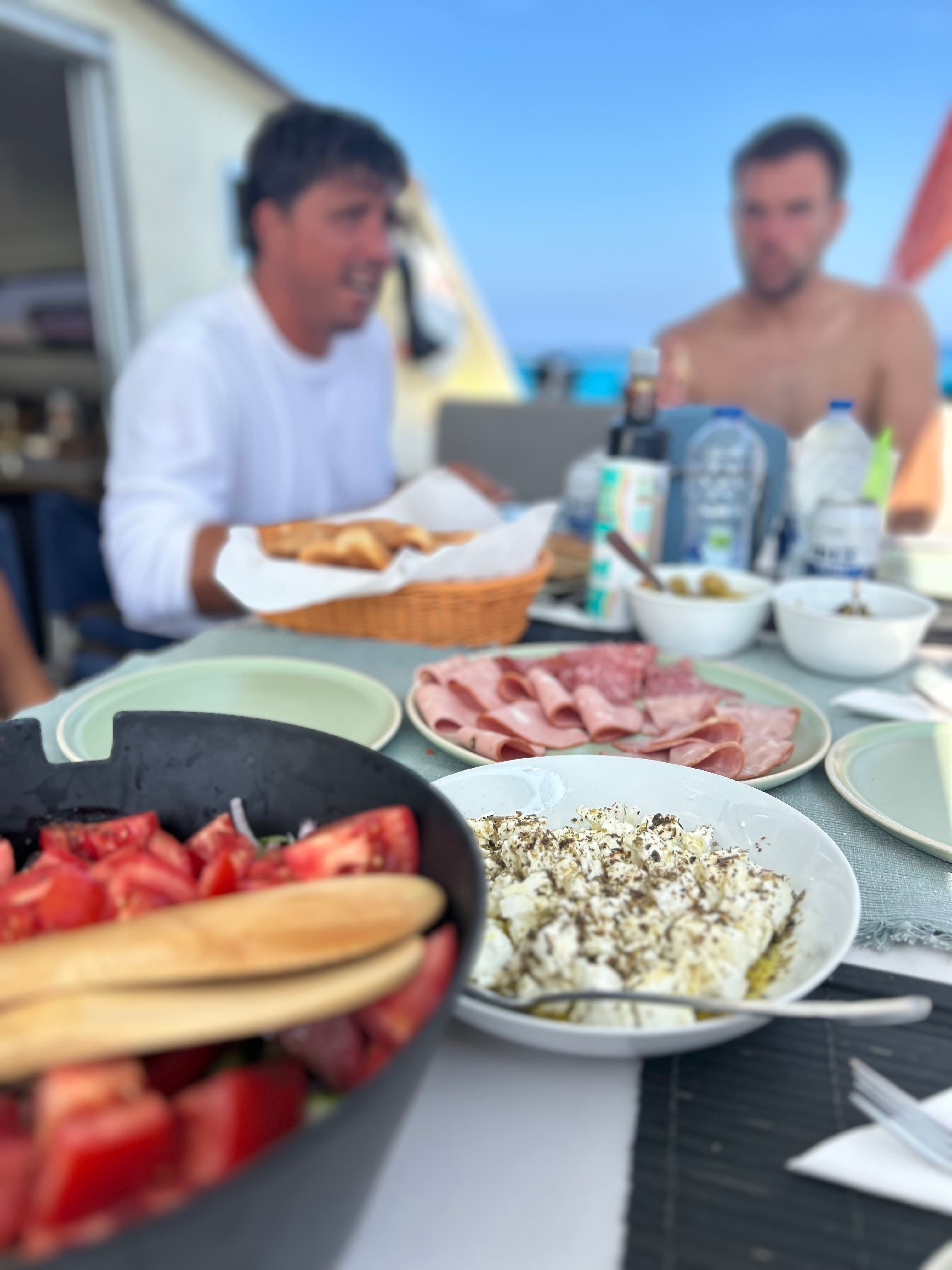 Small group enjoying gourmet dining on luxury catamaran