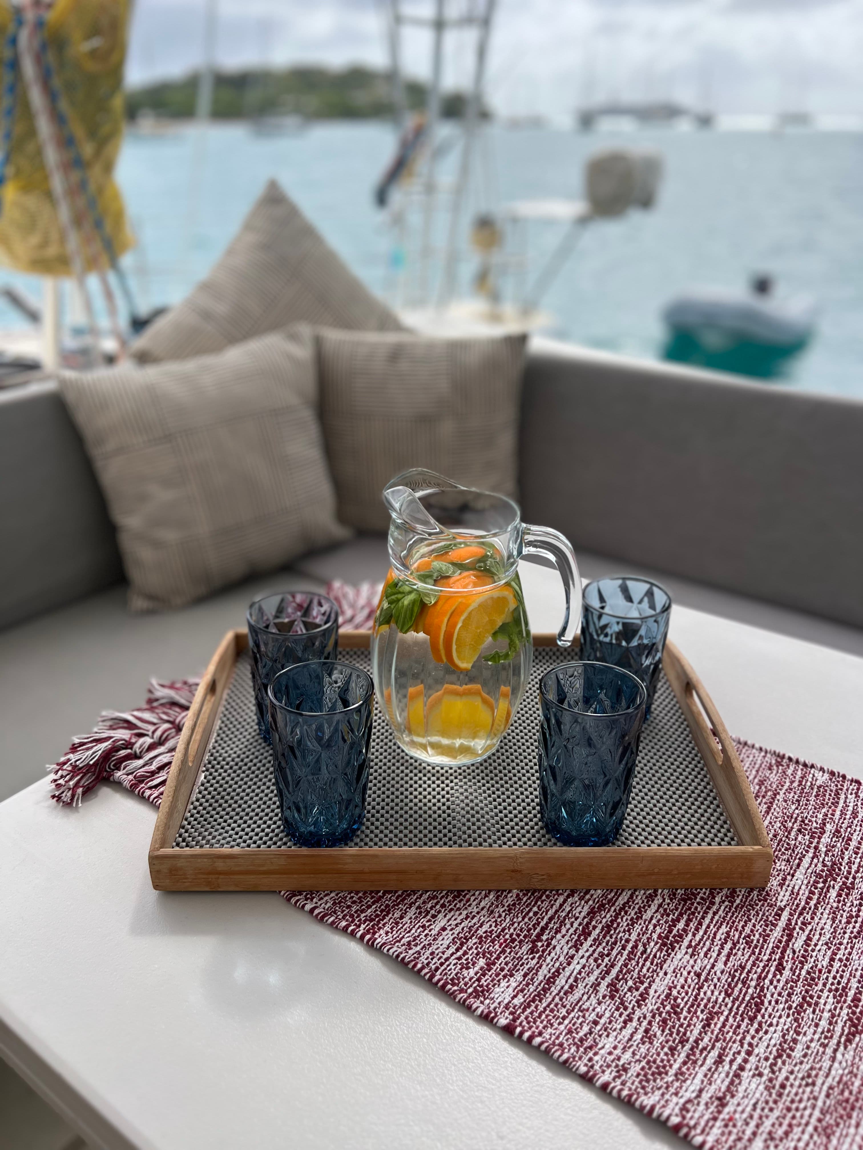 Intimate group enjoying drinks on catamaran deck